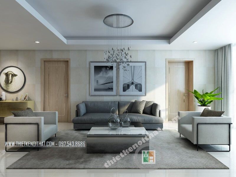 Mẫu thiết kế phòng khách chung cư đẹp với bộ sofa bọc vài màu xám và trắng tạo điểm nhấn nổi bật cho căn phòng.